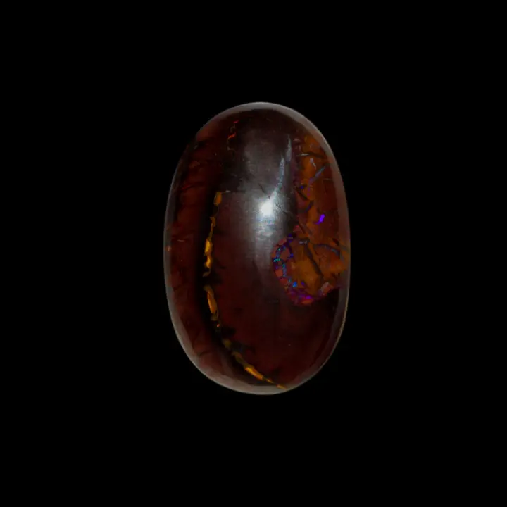 Natural Australian Koroit opal resembling a coffee bean with some purple glitter, 25 carat cabochon