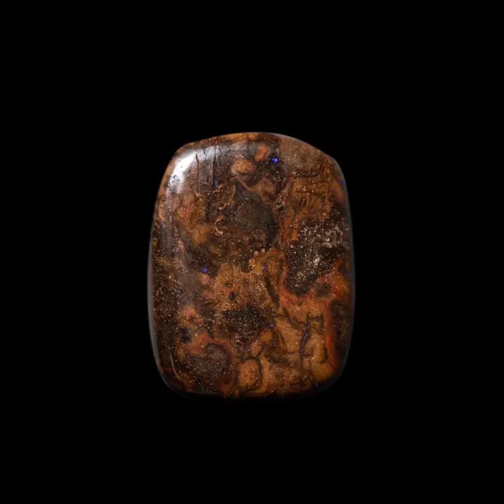 Natural Australian Koroit opal cut into a rectangle of pretty shades of brown and dotted with purple microglitter.