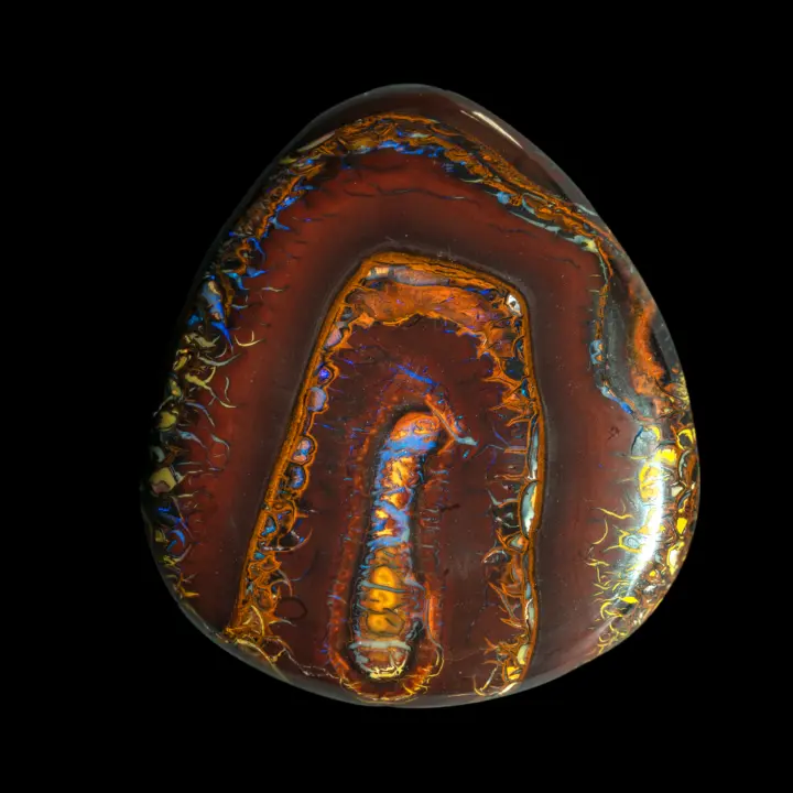 Free-form, intensely colored Australian Koroit natural opal with finely colored, contrasting and highly decorative borders and arabesques, studded with brilliant violet flakes.