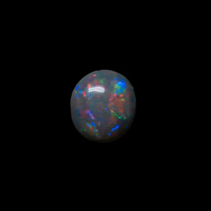 Opale naturelle australienne des mines de Lightning Ridge, petit cabochon sombre de 0,1 carats à brillances multicolores