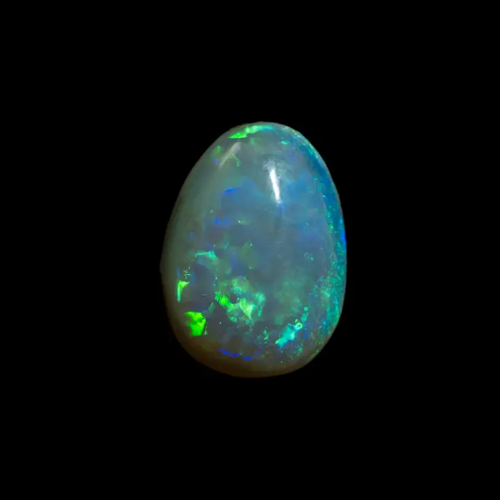 Natural dark crystal opal from the Australian Lightning Ridge mines, one carat of blue and green brilliance.