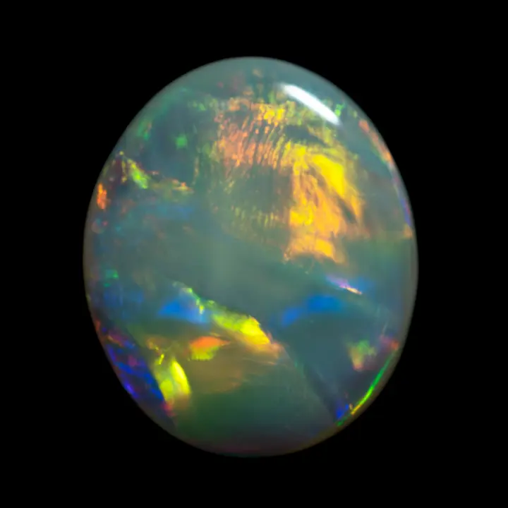 Natural Australian Lightning Ridge white opal with compartmentalized diffraction and multicolored complex.