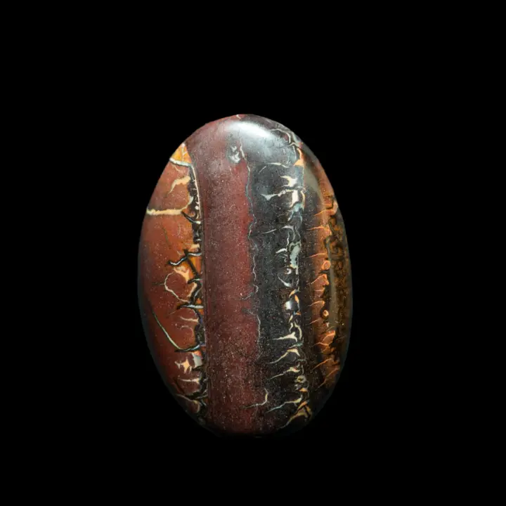 Natural Australian Koroit opal, oval of 28.5 carats with contrasting stripe patterns and reminiscent of ancient cuneiform writing