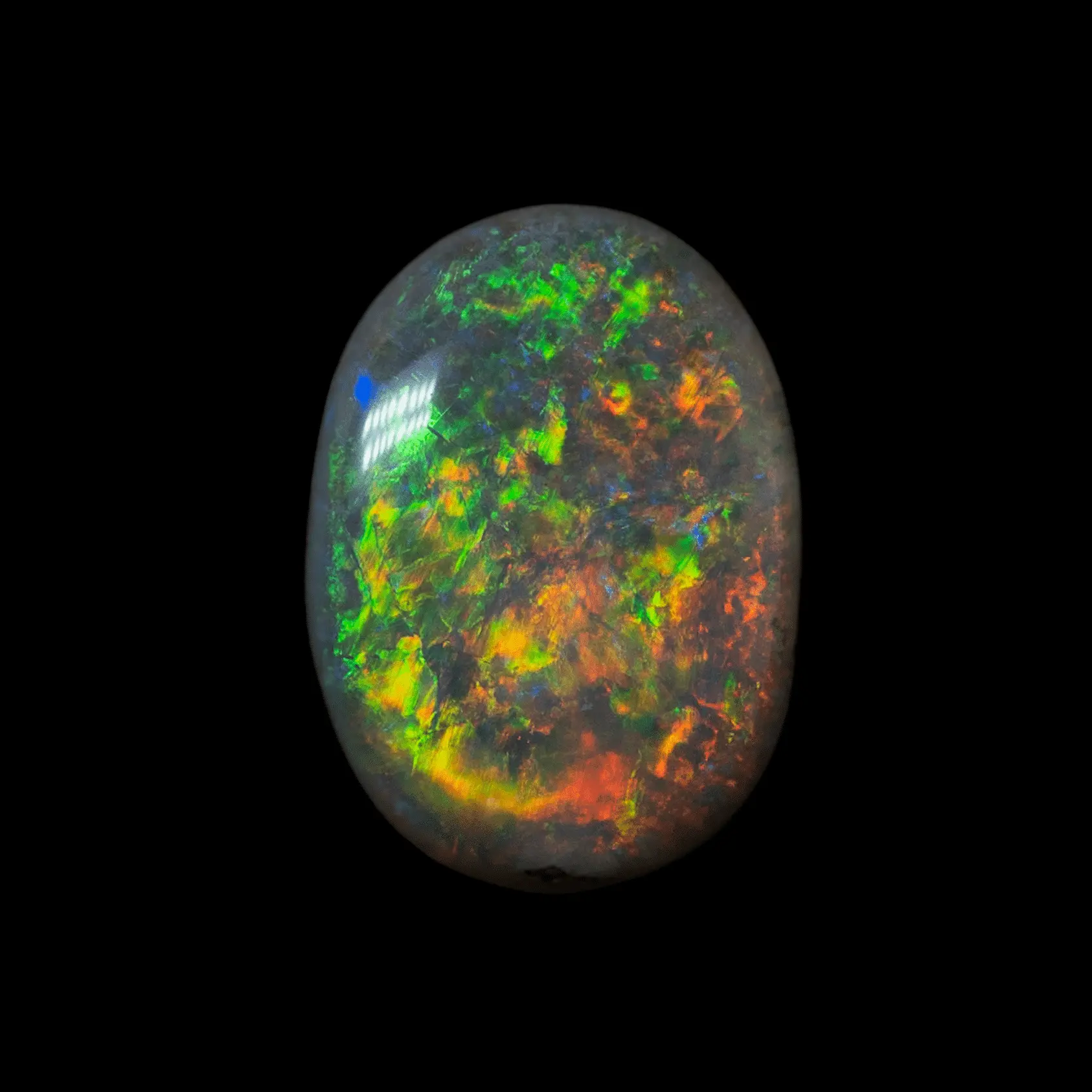 Natural Australian opal from the Coober Pedy mines, very pretty cabochon of 1.3 carats, mostly shiny in green, yellow, orange and a little blue.