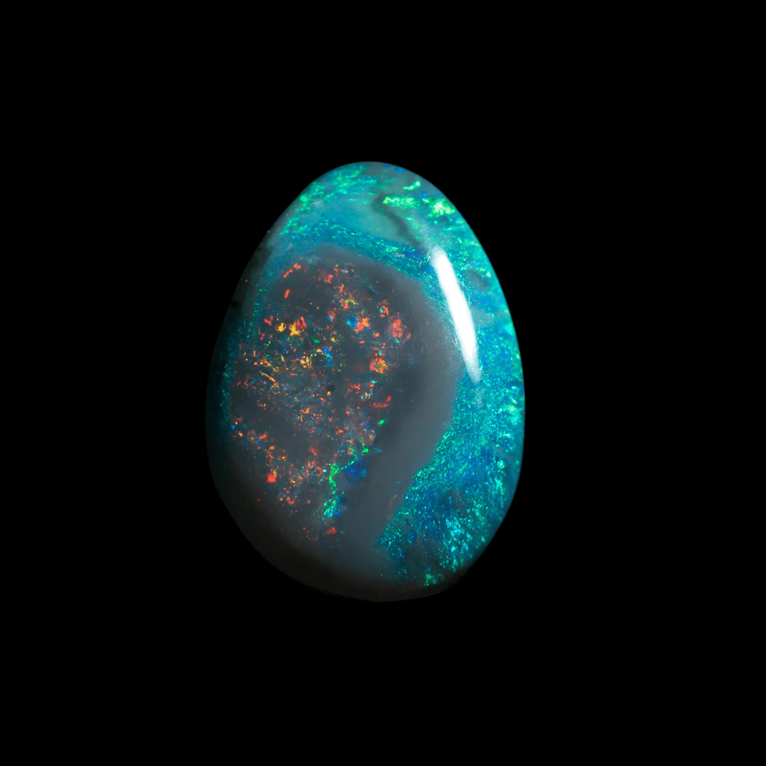 Natural Australian opal from the Lightning Ridge mines, 3 carats, almond-shaped, with red heart surrounded by green.