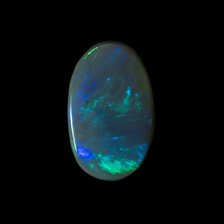 Natural Australian opal from the Lightning Ridge mines, large cabochon of 3.40 carats with beautiful green and blue brilliance well distributed over its entire surface.