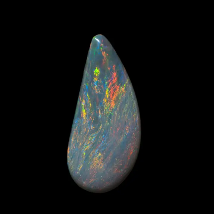 Natural Australian opal from the Lightning Ridge mines, beautiful dark opal teardrop of 2.8 carats, streaked with small multicolored iridescent lines of changing colors.