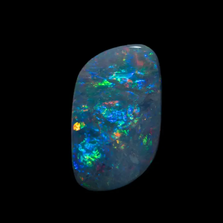 Natural Australian opal from the Lightning Ridge mines, free-form near diamond shape of 2.1 carats intensely colored, multicolored and very bright