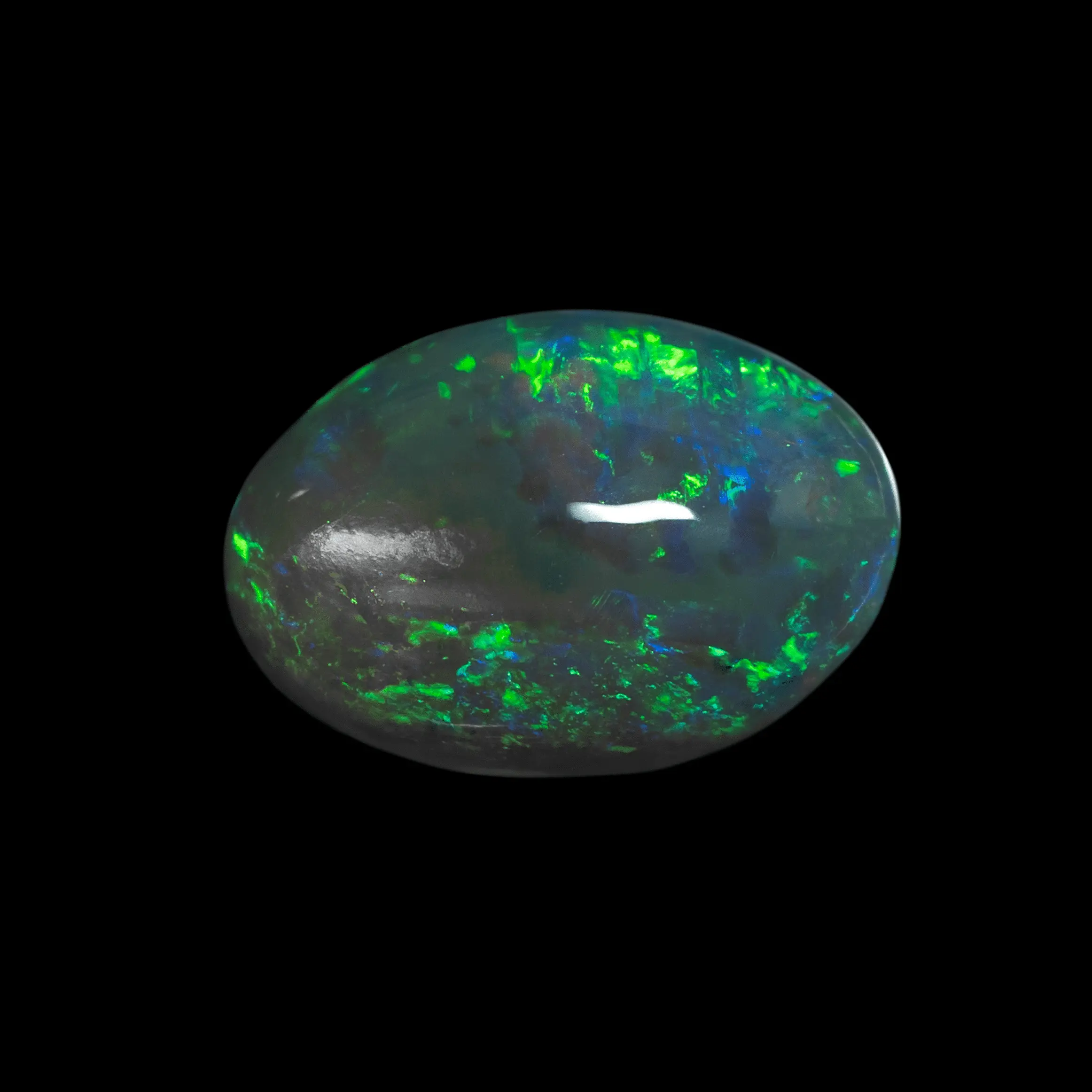 Natural Australian opal from the Lightning Ridge mines, 2.1 carats cut in the shape of a translucent oval cabochon, shining generously in green and blue.