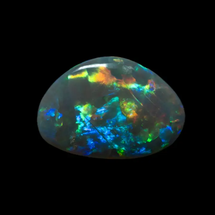 Natural Australian opal from the Lightning Ridge mines, 1.5 carats cut in a free-form shape to maximize the magnificence of the changing and brilliant colors of this dark opal, a wonder of nature!