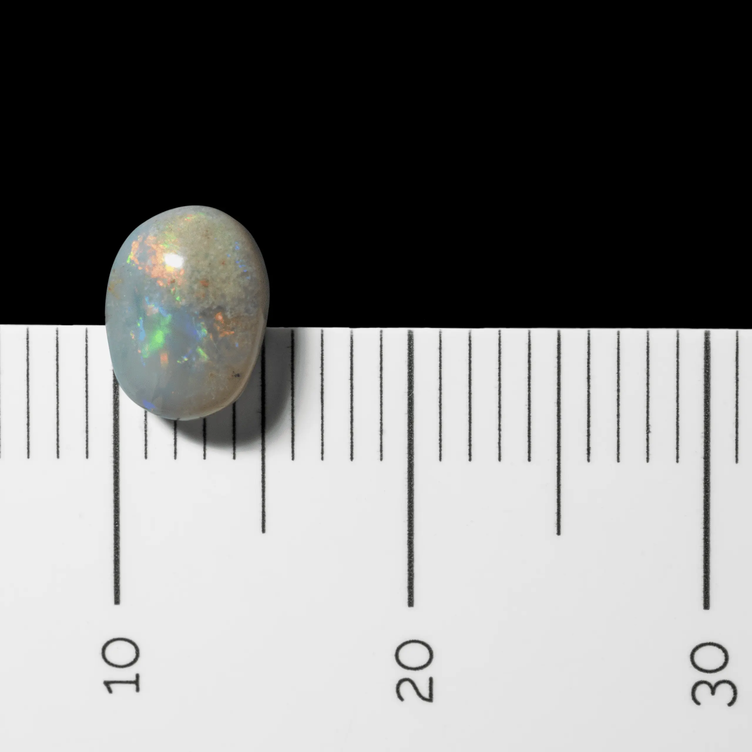 Petit cabochon opalisé orange et bleu (0,7 ct) – Image 8