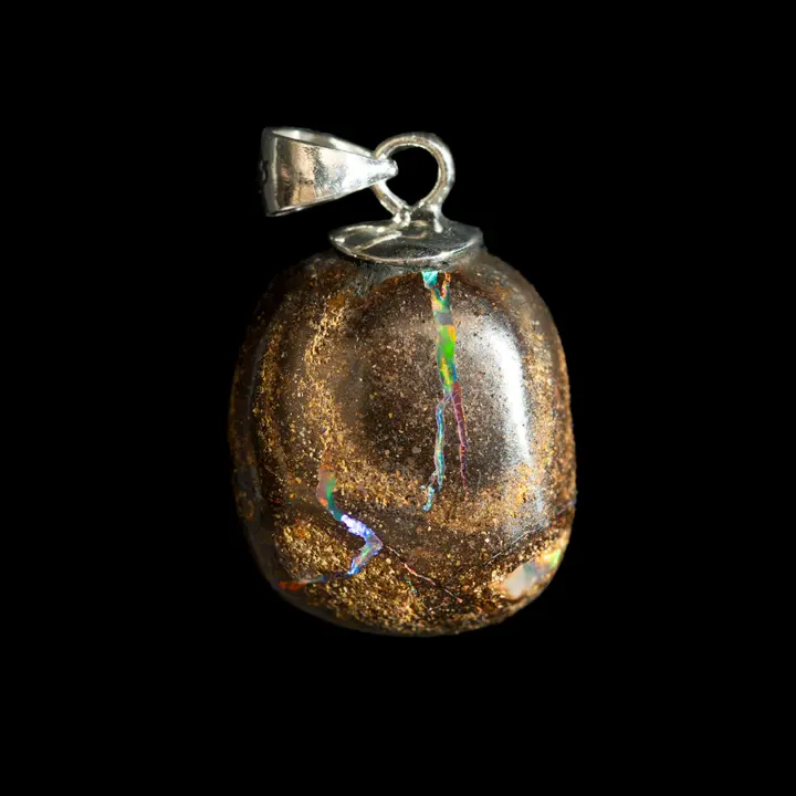 Natural Australian opal from the Koroit mines, diacrite cabochon with a brilliant multicolored barred O of 12.0 carats mounted on a 925 silver setting evoking an on-off button.