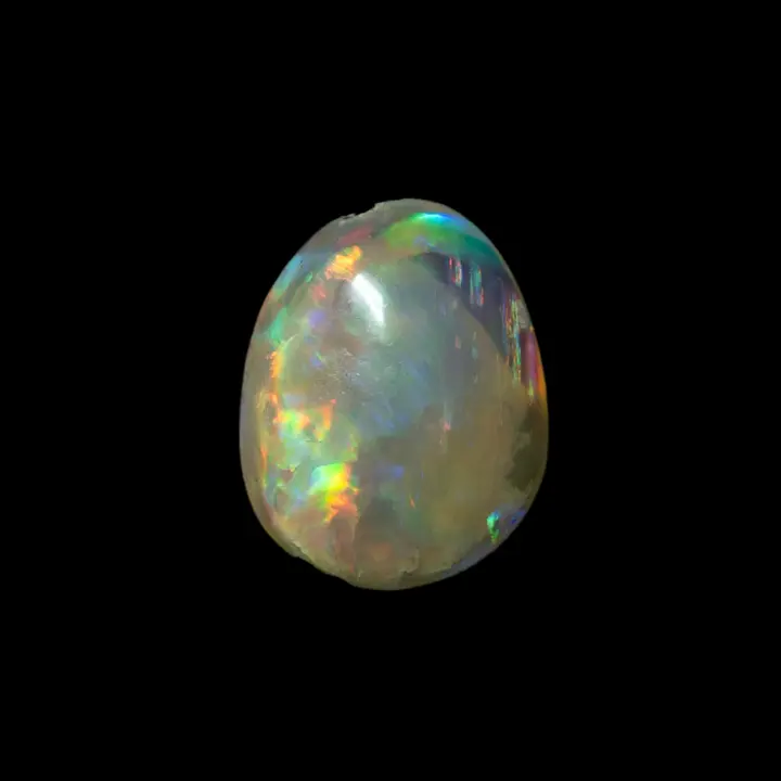 Natural Australian opal from the Lightning Ridge mines, small 0.3-carat cabochon of multicolored crystal-clear opal with slightly acid hues