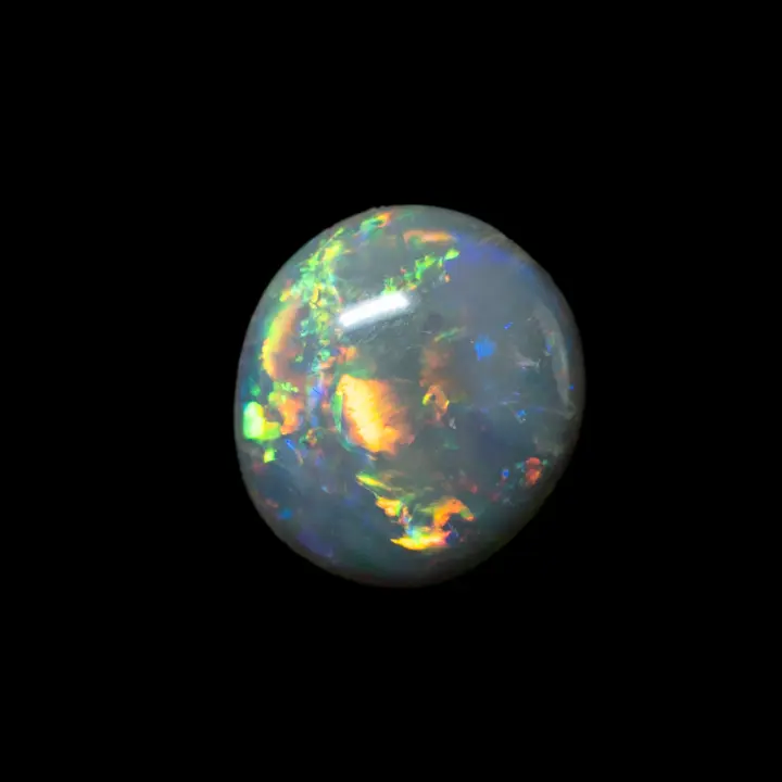 Natural Australian opal from the Lightning Ridge mines, almost round cabochon of 0.75 carat with multicolored lines of clean, well-distributed colors.