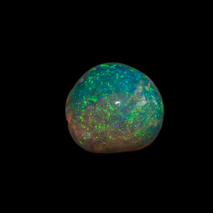 Opale naturelle australienne des mines de Lightning Ridge, demi sphère de 0,4 carat de cristal clair à dominante colorée verte et jaune