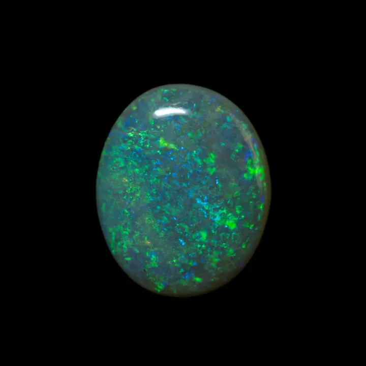 Natural Australian opal from the Lightning Ridge mines, large cabochon of 2.25 carats with green and blue diffracted colors harmoniously distributed over its entire surface.