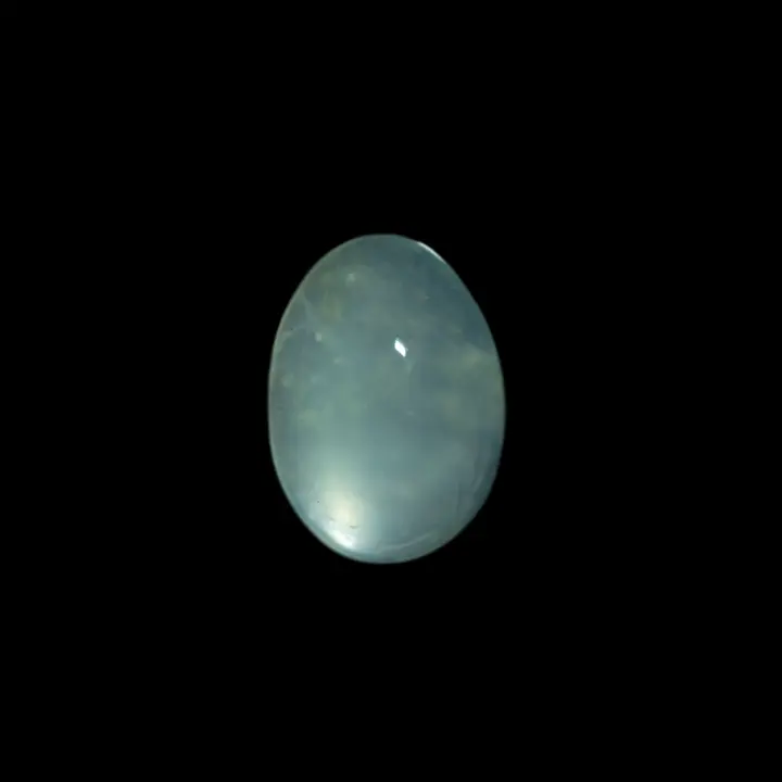 8.5 carat oval Peruvian opal with blue-grey transparent crystal