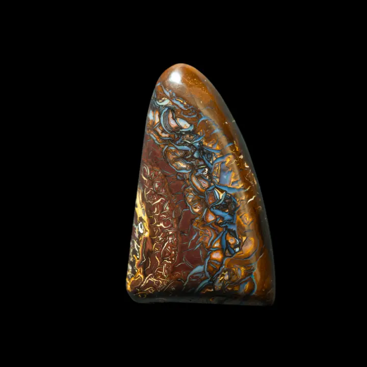 Natural Australian opal from the Koroit mines, triangular shape of 22.9 carats, reminiscent of a tooth finely ornamented with blue and yellow interlacing.
