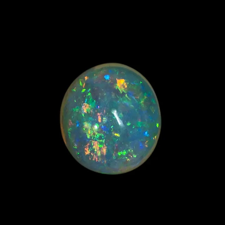 Natural Brazilian opal from the Horca mines, 0.7 carat round clear opal, polished on both sides, very bright green, yellow and green.