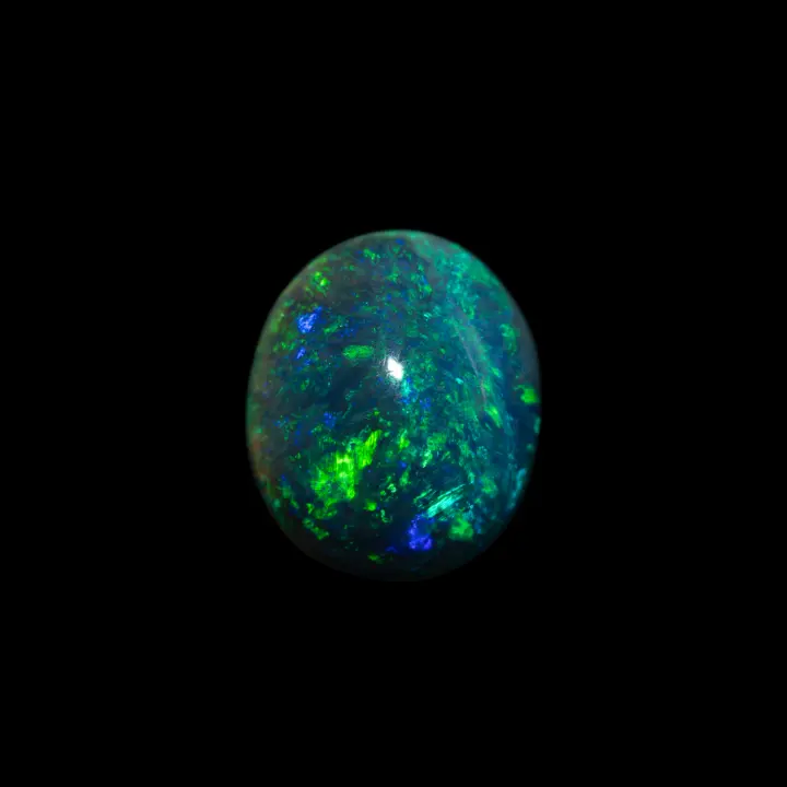 Natural Australian black opal from the Lightning Ridge mines, green-blue cabochon of 2.2 carats of high quality color and brilliance.