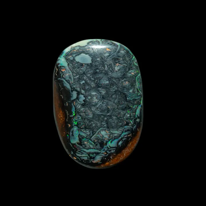 Natural Australian opal from the Koroit mines, elliptical freeform of 24.3 carats with geometric patterns evoking topography in black lines encircling sky-blue curves; the whole is framed by green and blue brilliance.
