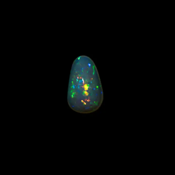 Natural Brazilian opal from the Horca mines, 1.4 carat freeform cabochon with multicolored brilliance and very clear matrix.