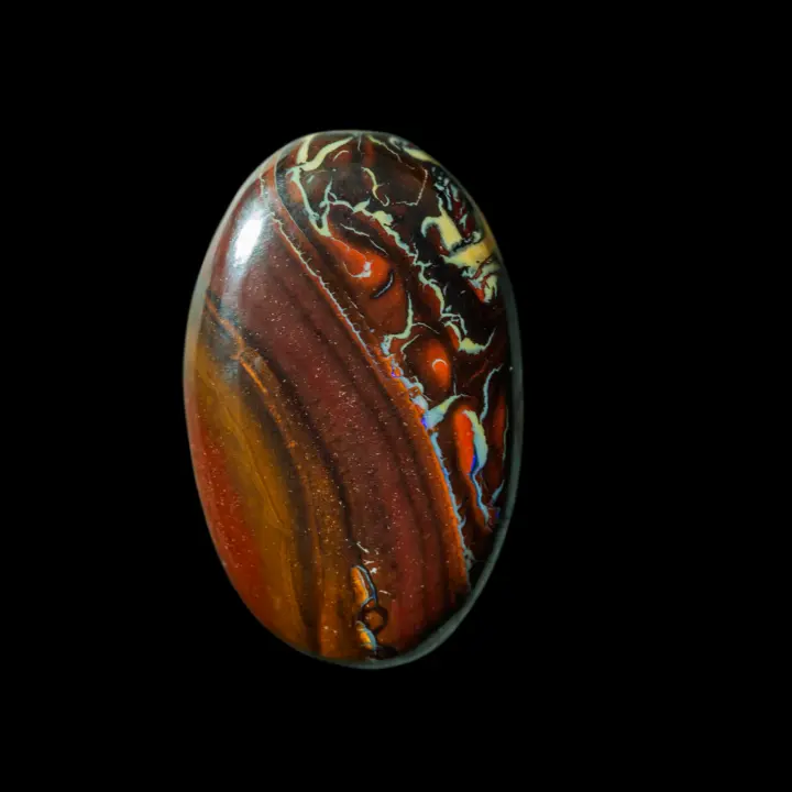 Natural Australian opal from the Koroit mines, oval of 23.3 carats finely decorated with colorful and contrasting curves of browns, reds, yellows and blues.