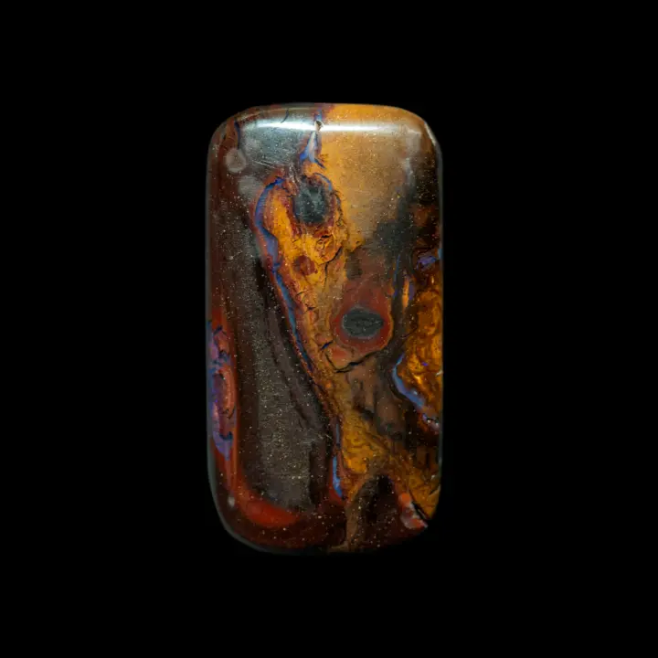 Natural Australian opal from the Koroit mines, 25.2 carat rectangle fluted with ochre, brown and black arabesques and furrowed with purple veins.