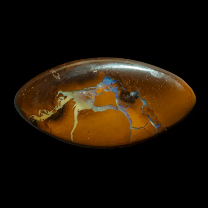 Natural Australian opal from the Koroit mines, ochre and brown tapered oval shape of 31.1 carats crossed with bluish opalization