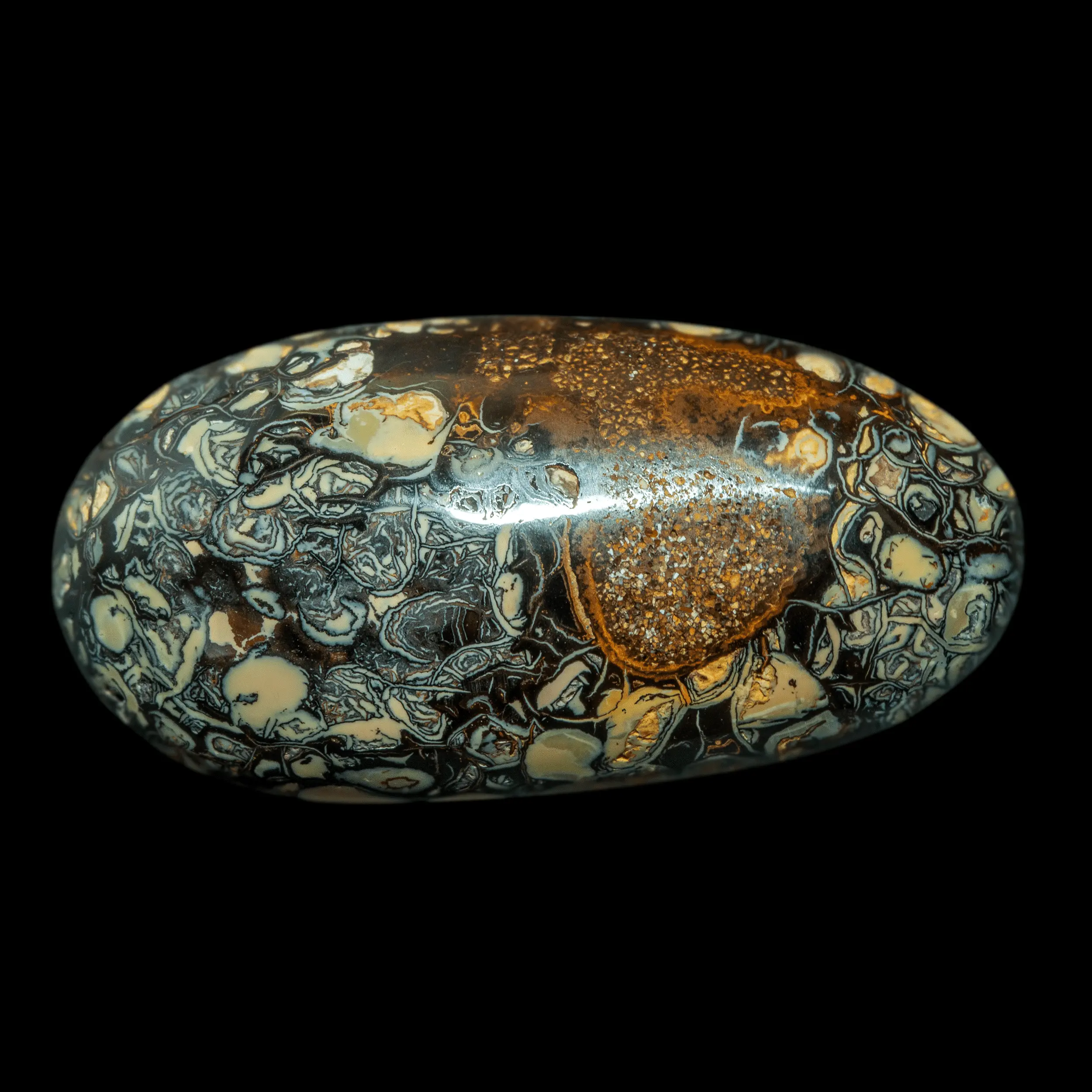 Natural Australian opal from the Koroit mines, 41.1-carat ovoid cabochon decorated with vanilla, caramel and licorice motifs on one side and open yellow on the other.
