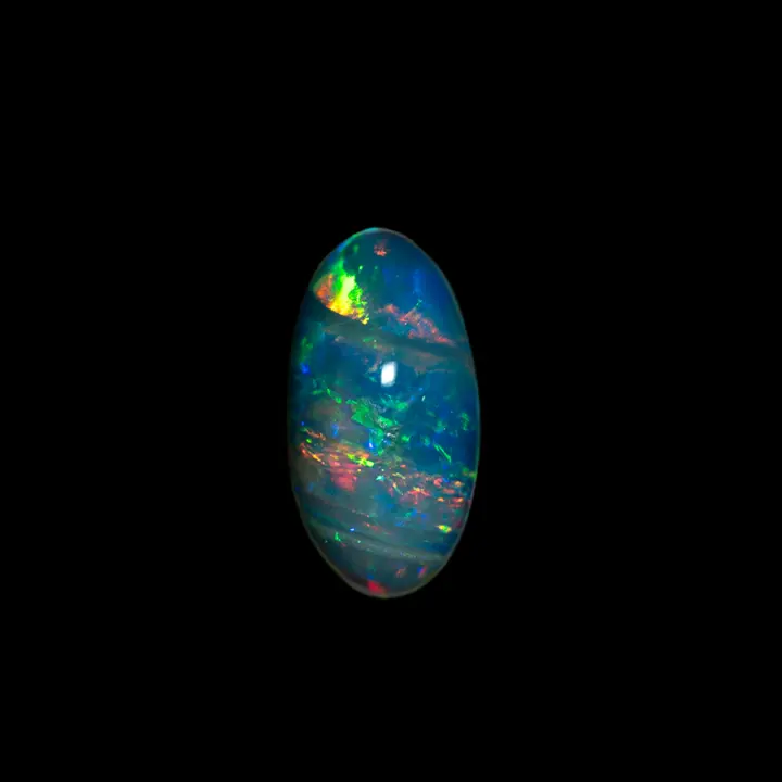 Natural Brazilian opal from the Horca mines, tapered oval shape of one carat, very transparent and very bright, polished on both sides, multicolored, appearing to be adorned with ribbons.