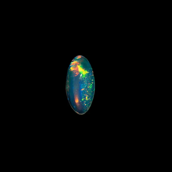 Natural Brazilian opal from the Horca mines; very clear crystal of 0.3 carat, very luminous and highly colored with green, yellow and blue predominance.