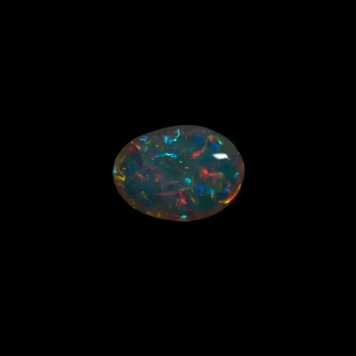 Natural Brazilian opal from the Horca mines, 1.9 carat clear crystal cabochon with multicolored, predominantly green lustre