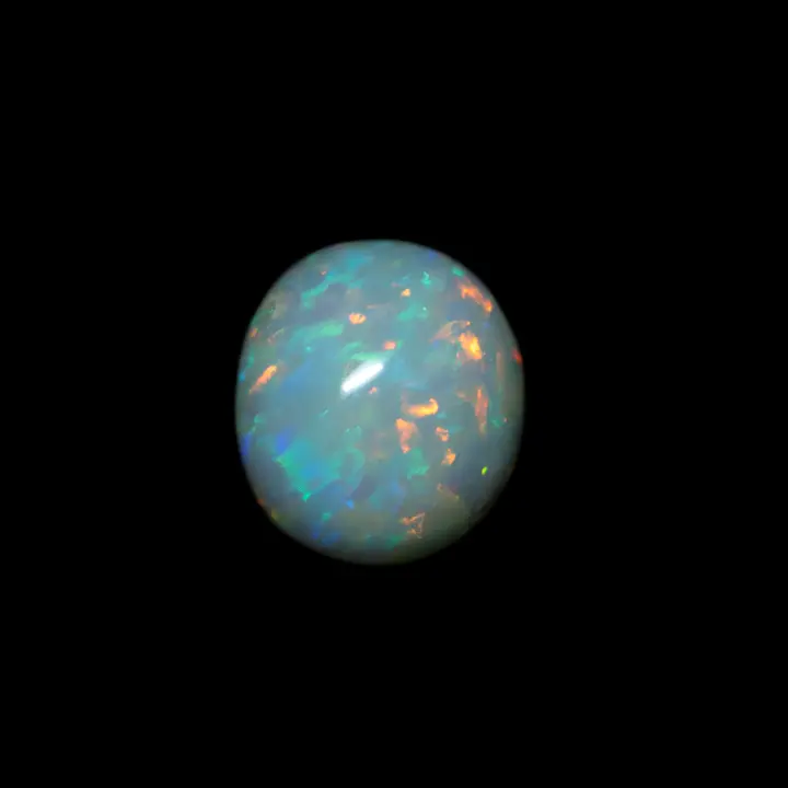 Natural Australian opal from the Coober Pedy mines, small milky cabochon of 0.9 carat with brilliant brushstrokes of orange and blue.