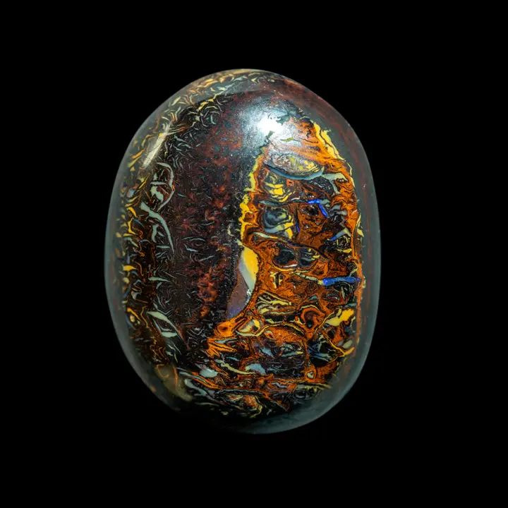 Natural Australian opal from the Koroit mines, 16.3-carat opal cabochon with highly decorative, contrasting patterns of yellow, brown, blue and orange.