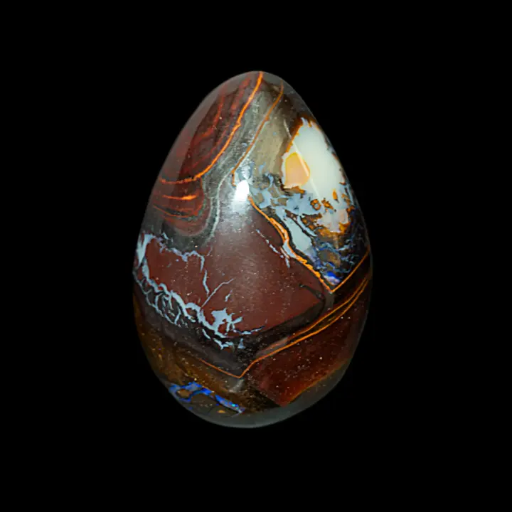 Natural opal from Australia's Koroit mines, 27.0 carat teardrop shape with colorful, contrasting patterns evoking a tormented landscape