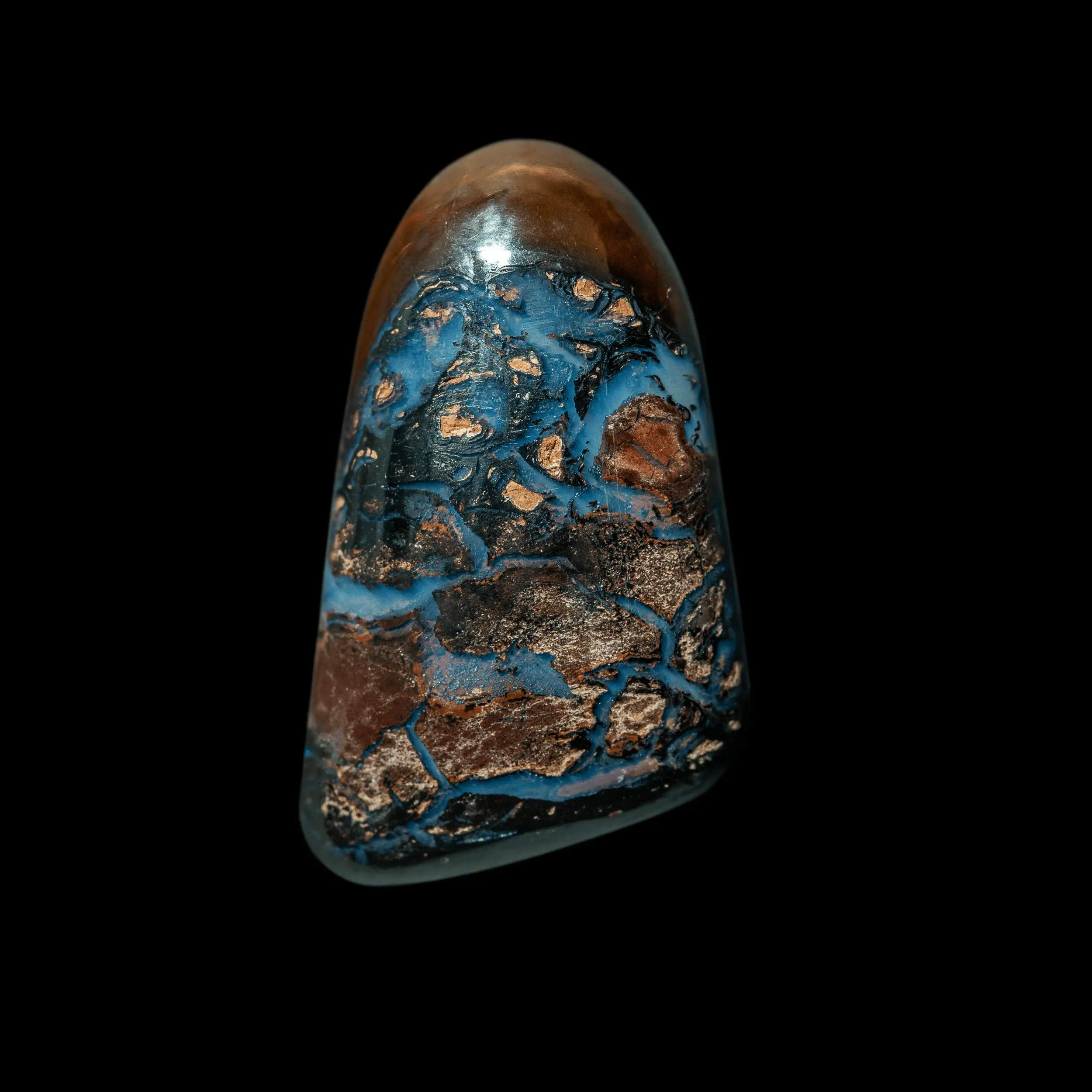 Natural Australian opal from the Koroit mines, free form 19.3 carats with brown matrix crossed by flows of bluish opalization