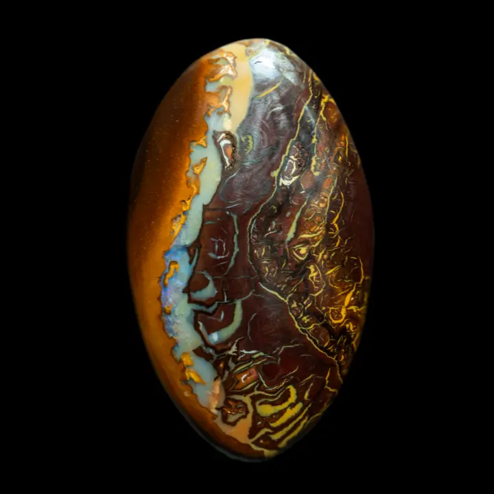 Natural Australian opal from the Koroit mines, large oval cabochon of 30.1 carats, very aesthetic, covered with constricted colors and opalization.