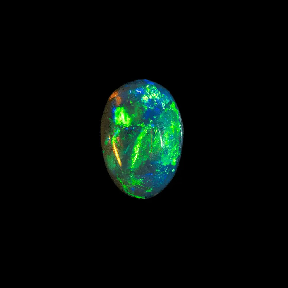 Natural Australian opal from the Lightning Ridge mines, oval dark crystal cabochon of 2.3 carats with intense predominantly green brilliance.