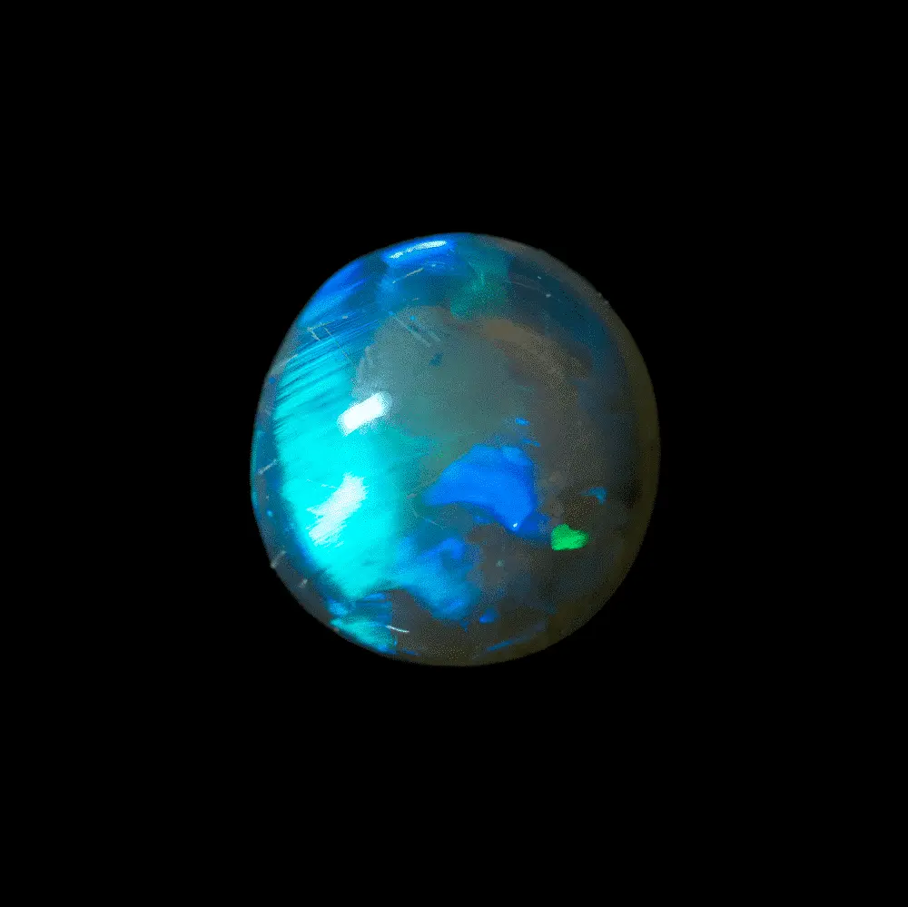 Natural Australian opal from the Lightning Ridge mines, circular cabochon of very transparent dark crystal of 2 carats with large bright green, blue, purple and some mineral inclusions.