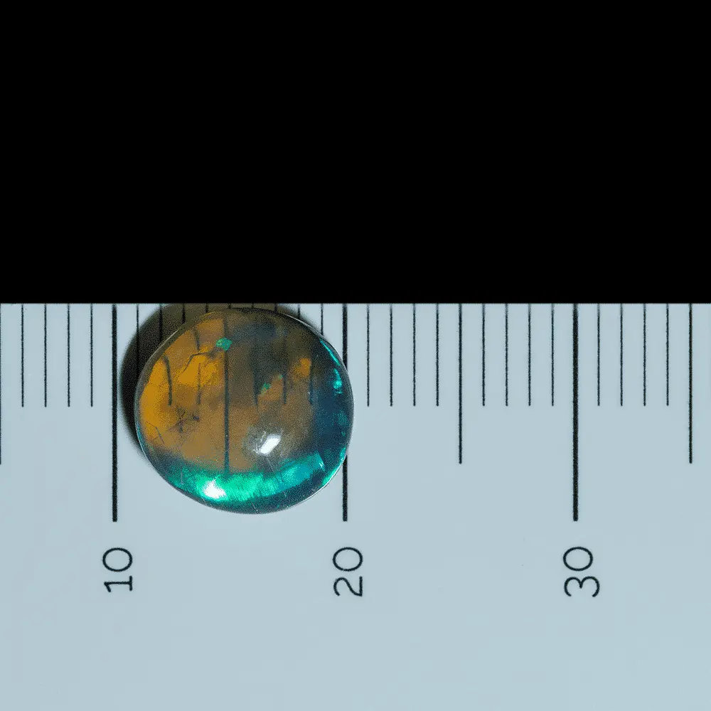 Very crystalline dark opal cabochon illuminated by large electric blue, green and violet flashes (2.0 cts) - Image 5