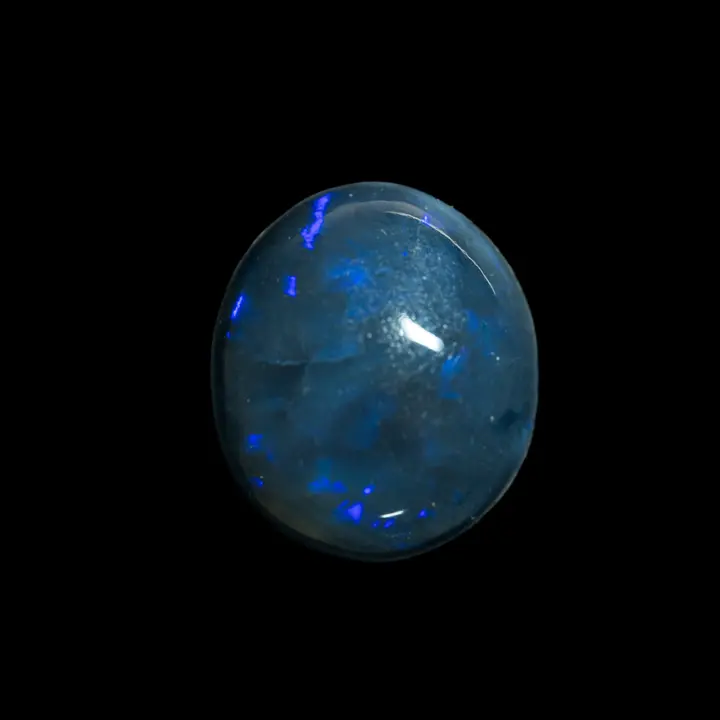 Natural Australian opal from the Lightning Ridge mines, very black 8-carat cabochon with discreet violet sparkles