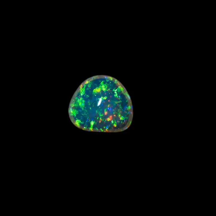 Natural white opal Brazilian crystal from the Horca mines, 0.9 carat shape reminiscent of the polished triangle on both sides, very clear, ultra shiny with a dominant green colour