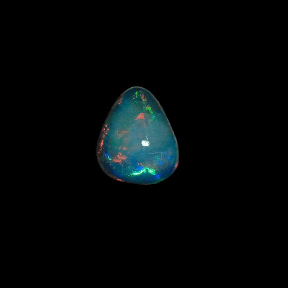 Opale naturelle Brésilienne des mines d'Horca, forme libre cristalline de 0,9 carats polie sur ces deux faces à brillances multicolores agrémentée d'une grande zone d'un magnifique orangé brillant