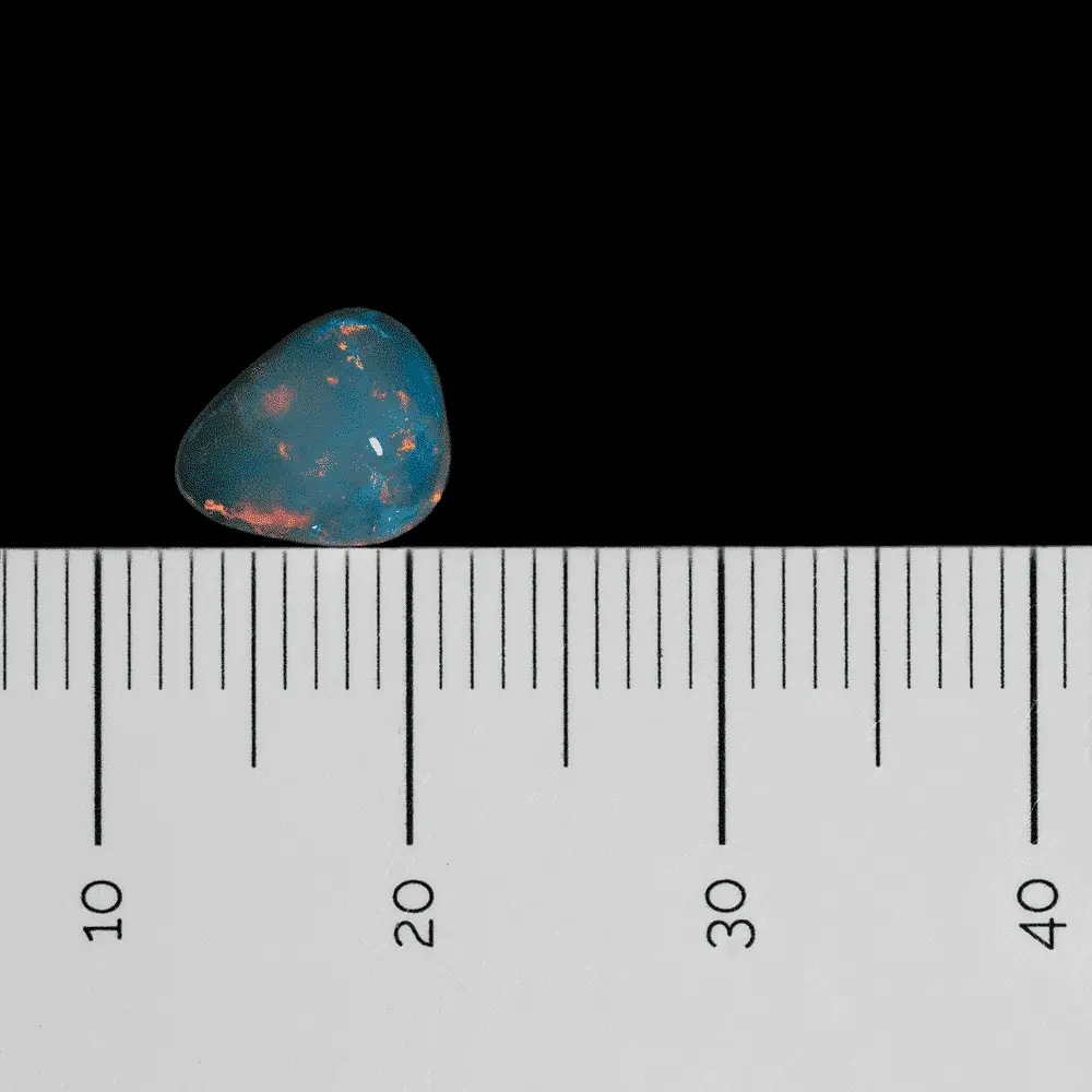 L'opale cristal tachée d'orange flamboyant (0,9 cts) – Image 8