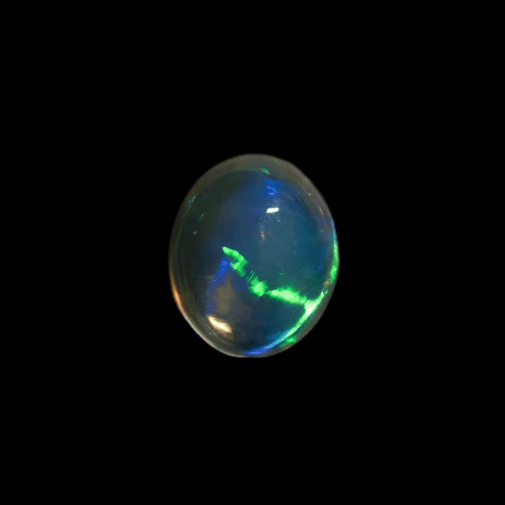 Opale naturelle australienne des mines de Lightning Ridge, cabochon de cristal clair transparent de 1,2 carat traversé d'un intense trait de lumière verte et bleue