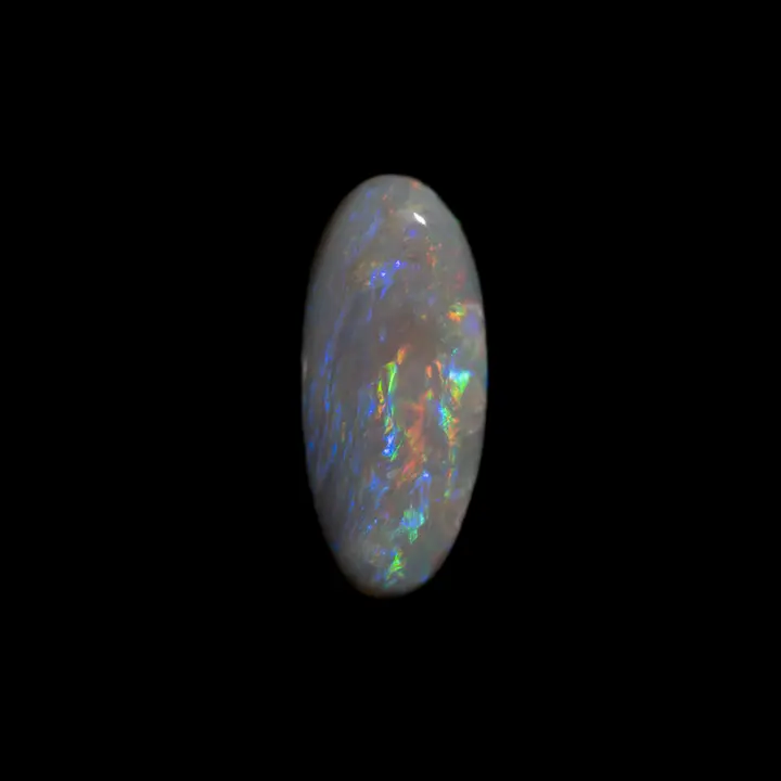 Dark Australian natural opal from the Lightning Ridge mines, 1.1 carat elliptical shape with multi-coloured colouring highlighted by a ripple of blue-purple threads