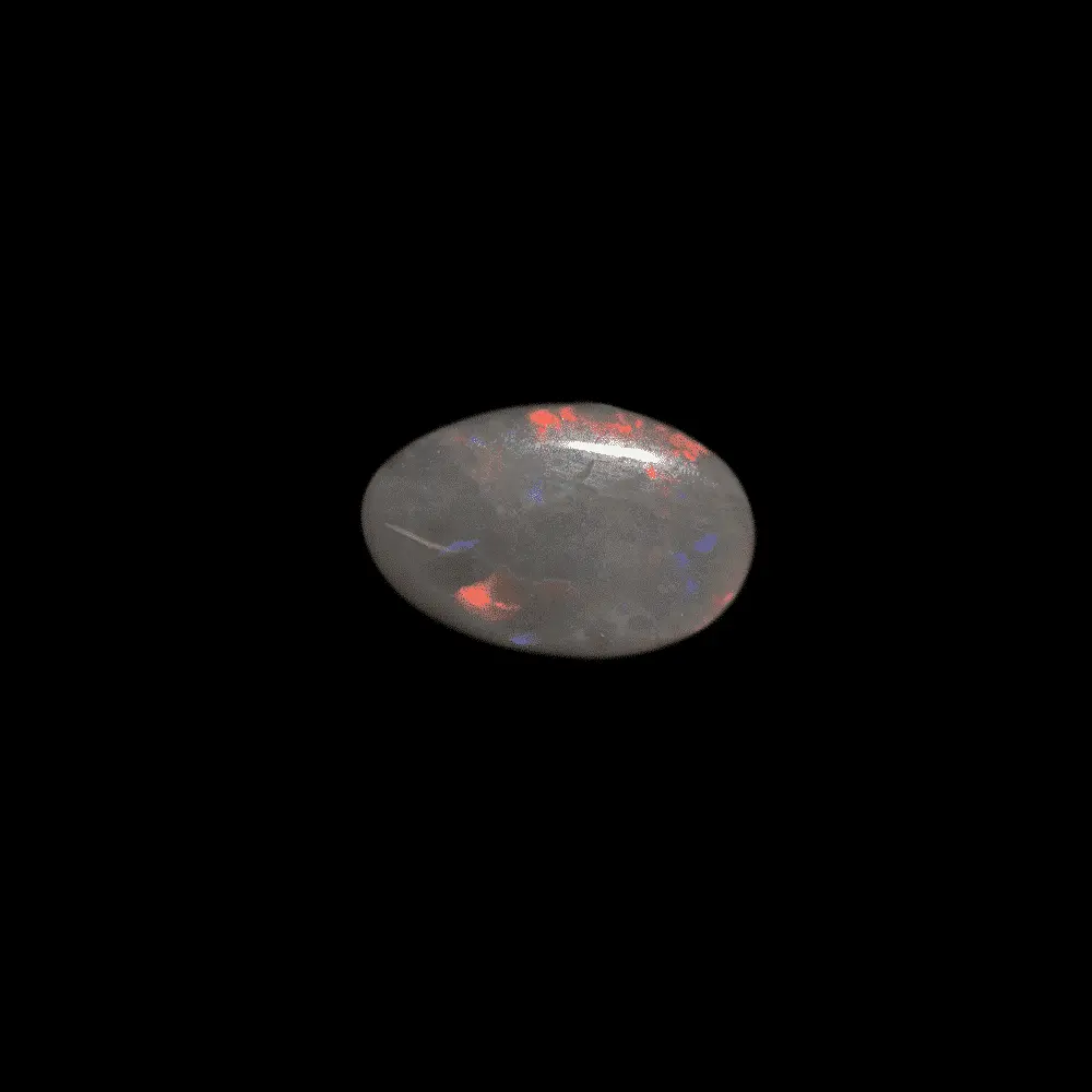 Opale naturelle australienne des mines de Lightning Ridge, forme de larme de 1,1 carat à éclats colorés bien marqués rouges, violet et vert