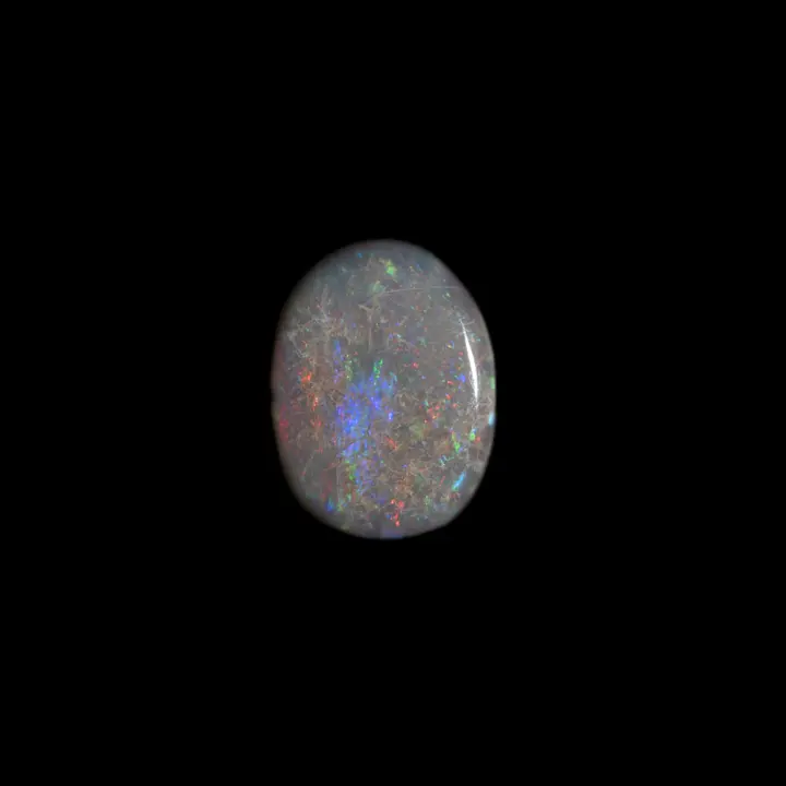 Natural Australian opal from the Lightning Ridge mines, 0.7 carat cabochon with opalized ridged matrix in red, orange and blue