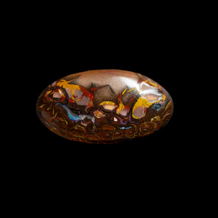 Australian Koroit Natural Opal, 20.7 carat oval shape with brightly coloured designs intertwined in red, yellow and blue scrolls